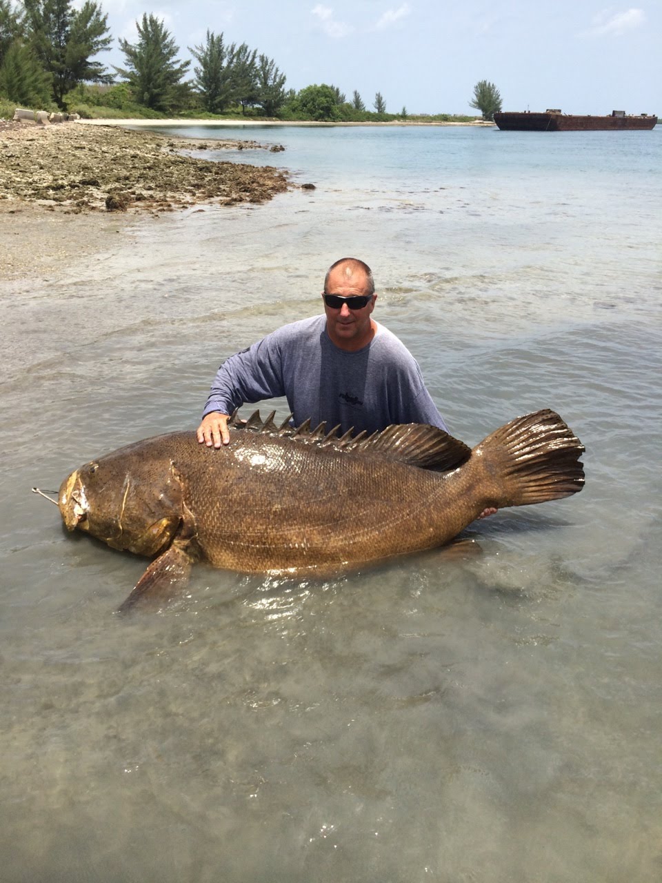 Roy Bass holding large fish