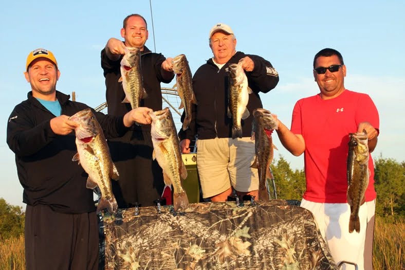 whole group holding fish